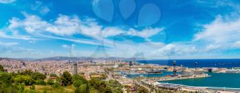 Panoramic aerial view of Barcelona and port in a beautiful summer day, Catalonia, Spain