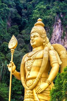 Statue of hindu god Murugan at Batu cave in Kuala Lumpur, Malaysia at summer day