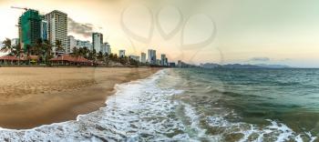 Panorama of Sunset on a beach at Nha Trang, Vietnam in a summer day