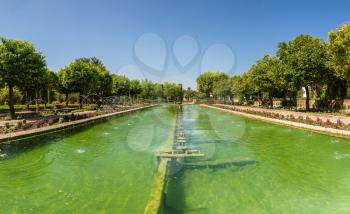 Fountains and Gardens at the Alcazar de los Reyes Cristianos in Cordoba in a beautiful summer day, Spain