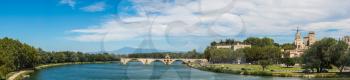 Saint Benezet bridge and Palace of the Popes in Avignon in a beautiful summer day, France