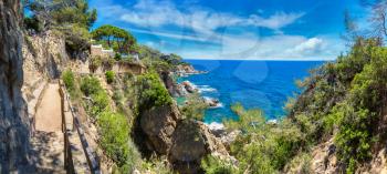 Panorama of Rocks on the coast of Lloret de Mar in a beautiful summer day, Costa Brava, 

Catalonia, Spain