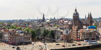 Panorama of Canal and St. Nicolas Church in Amsterdam in a beautiful summer day, The Netherlands