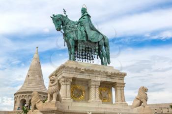 Horse riding statue of Stephen I the first king of Hungary in front of Fisherman's bastion in Budapest in Hungary in a beautiful summer day