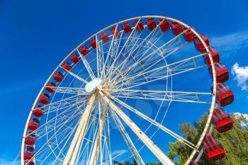 Ferris wheel on blue sky background in a beautiful summer day