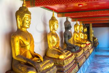 Gold Buddha Statue in Wat Pho Temple in Bangkok in a summer day