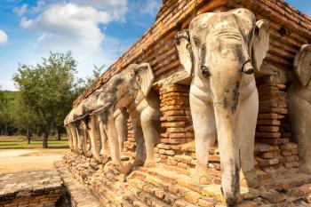Wat Sorasak Temple (Elephant Temple) in Sukhothai historical park, Thailand in a summer day