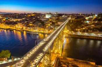 Panoramic aerial view of Dom Luis Bridge in Porto in a beautiful summer night, Portugal