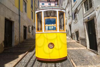 The Gloria Funicular in the city center of Lisbon in a beautiful summer day, Portugal