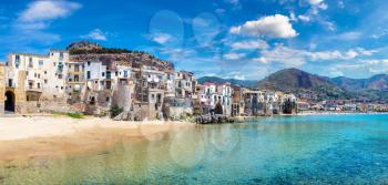 Panorama of Harbor and old houses in Cefalu in Sicily, Italy in a beautiful summer day