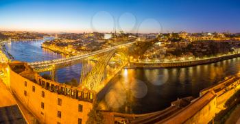 Panoramic aerial view of Dom Luis Bridge in Porto in a beautiful summer night, Portugal