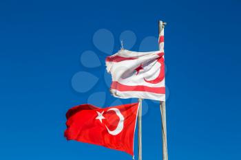 Flags of Turkey and North Cyprus in a beautiful summer day