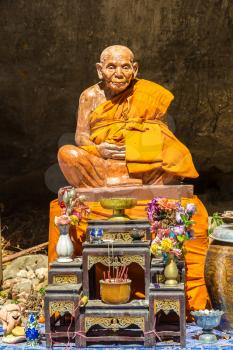 PHANG-NGA, THAILAND - MARCH 25, 2018: Traditional statue of monk in Thailand in a summer day