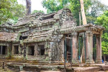 Ta Prohm temple ruins is Khmer ancient temple in complex Angkor Wat in Siem Reap, Cambodia in a summer day