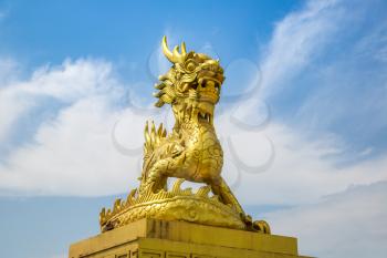 Golden dragon statue located inside Imperial Royal Palace, Forbidden city in Hue, Vietnam in a summer day