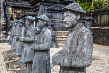 Tomb of Khai Dinh with Manadarin hnour guard in Hue, Vietnam in a summer day