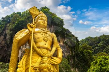 Statue of hindu god Murugan at Batu cave in Kuala Lumpur, Malaysia at summer day
