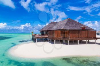 MALDIVES - JUNE 24, 2018: Water Villas (Bungalows) at Tropical beach in the Maldives at summer day