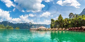 Panorama of Traditional Thai bungalows at Cheow Lan lake, Ratchaprapha Dam, Khao Sok National Park in Thailand in a summer day
