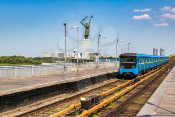 Metro (subway) train on metro bridge in Kiev, Ukraine in a beautiful summer day