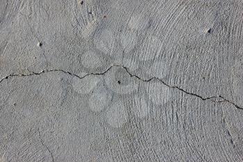 Grunge concrete cement wall with crack in industrial building