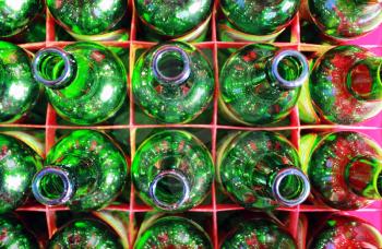 Beer Bottles of Green Glass.  Empty Green Bottlse in Box. Top view.