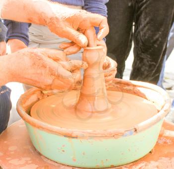 Hands working on pottery wheel. Pottery Work.