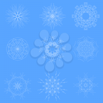White Snow Flakes Isolated on Blue Winter Background
