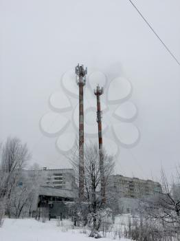 Power station in city. Industrial urban warm tower winter landscape
