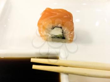 Sushi roll with salmon. Asian tasty seafood.
