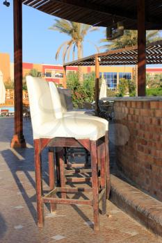 Wooden white chair. Tropical summer beach cafe