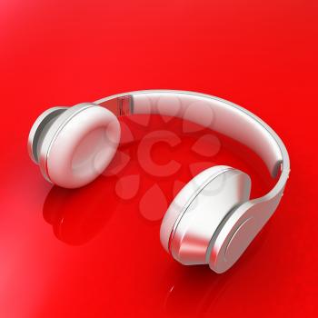 White headphones isolated on a red background 