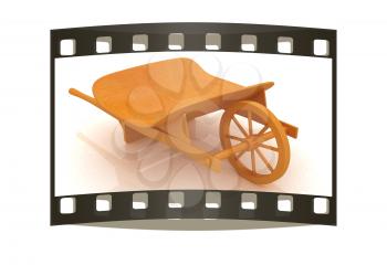 wooden wheelbarrow on a white background. The film strip