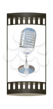 metal microphone on a white background. The film strip