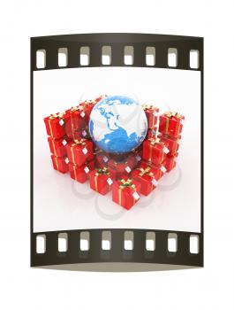 Traditional Christmas gifts and earth on a white background. Global holiday concept. The film strip