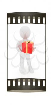 3d man gives red gift with gold ribbon on a white background. The film strip