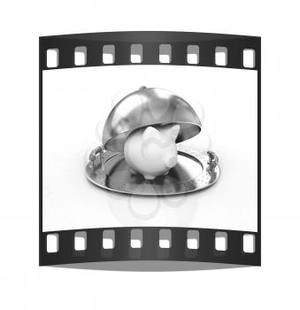 Glossy golden salver dish with piggy bank under a golden cover on a white background. The film strip
