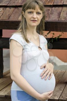 Image of pregnant woman in blue clothes