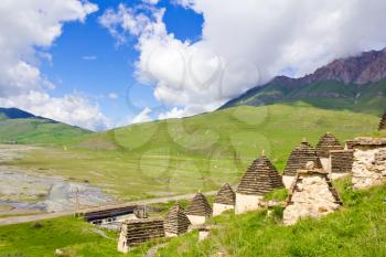 Summer landscape with graveyard in Caucasus mountains