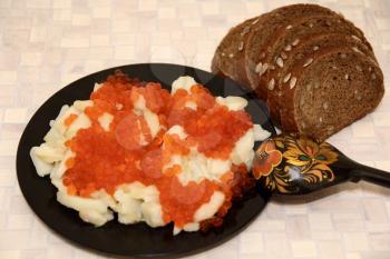 Still life with Russian national food caviar and potatoes