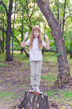 Photo of cute girl with upwards hands