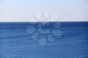 Image of calm breeze ocean and white yacht