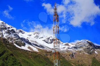 Photo of electricity tower in Caucasus mountains