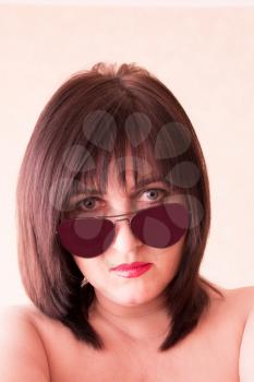 Photo of brunette woman face in sunglass