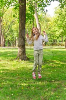 Photo of cute jumping girl in summer