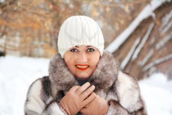 Portrait of beautiful young woman in winter coat