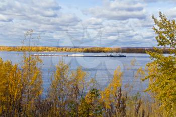 Photo of autumn landscape with barge
