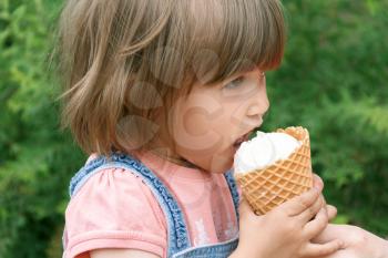 Horizonta photo of cute girl are eating icecream in summer time