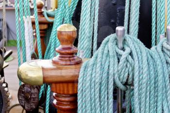 Thick green rope on board of ocean vessel
