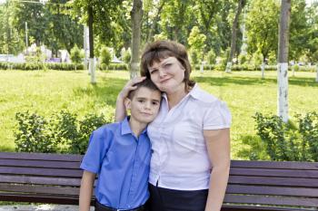Happiest mother and son eleven years old in summer time